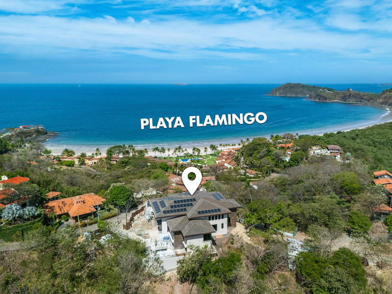 guanacaste real estate in playa flamingo showing luxury home by beach