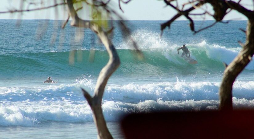 playa avellanas real estate showing surfers