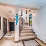 casa palacio interior with white tile flooring and staricase