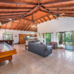 casa palacio interior showing suffleboard table and open area